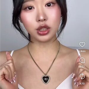 CHANEL Necklace with Black Heart Pendant and Pearl Accent